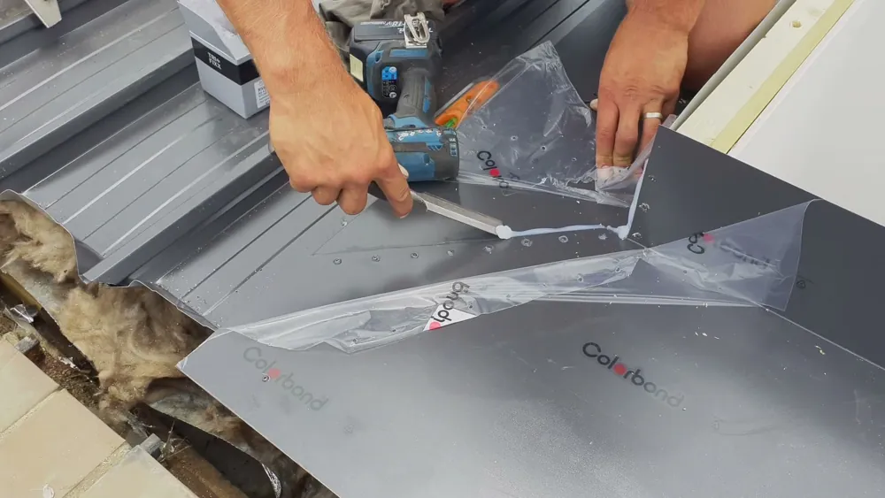 New Colorbond flashing being sealed around a skylight