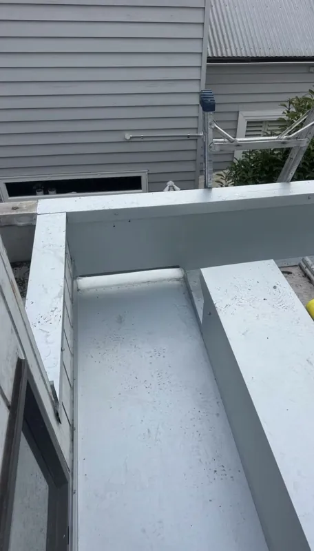 New box gutter running into a sump at the roof edge