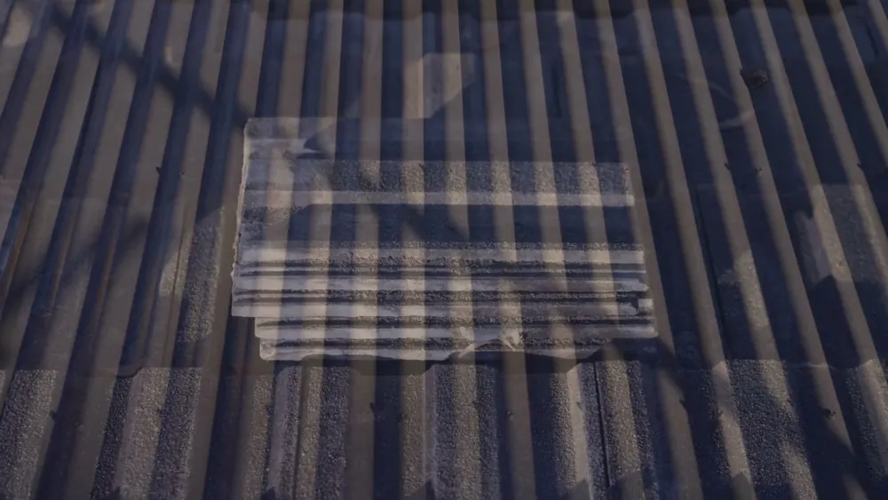 Patched section of metal roof sheeting