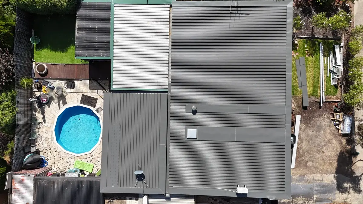 New Colorbond roof from above, next to a backyard pool