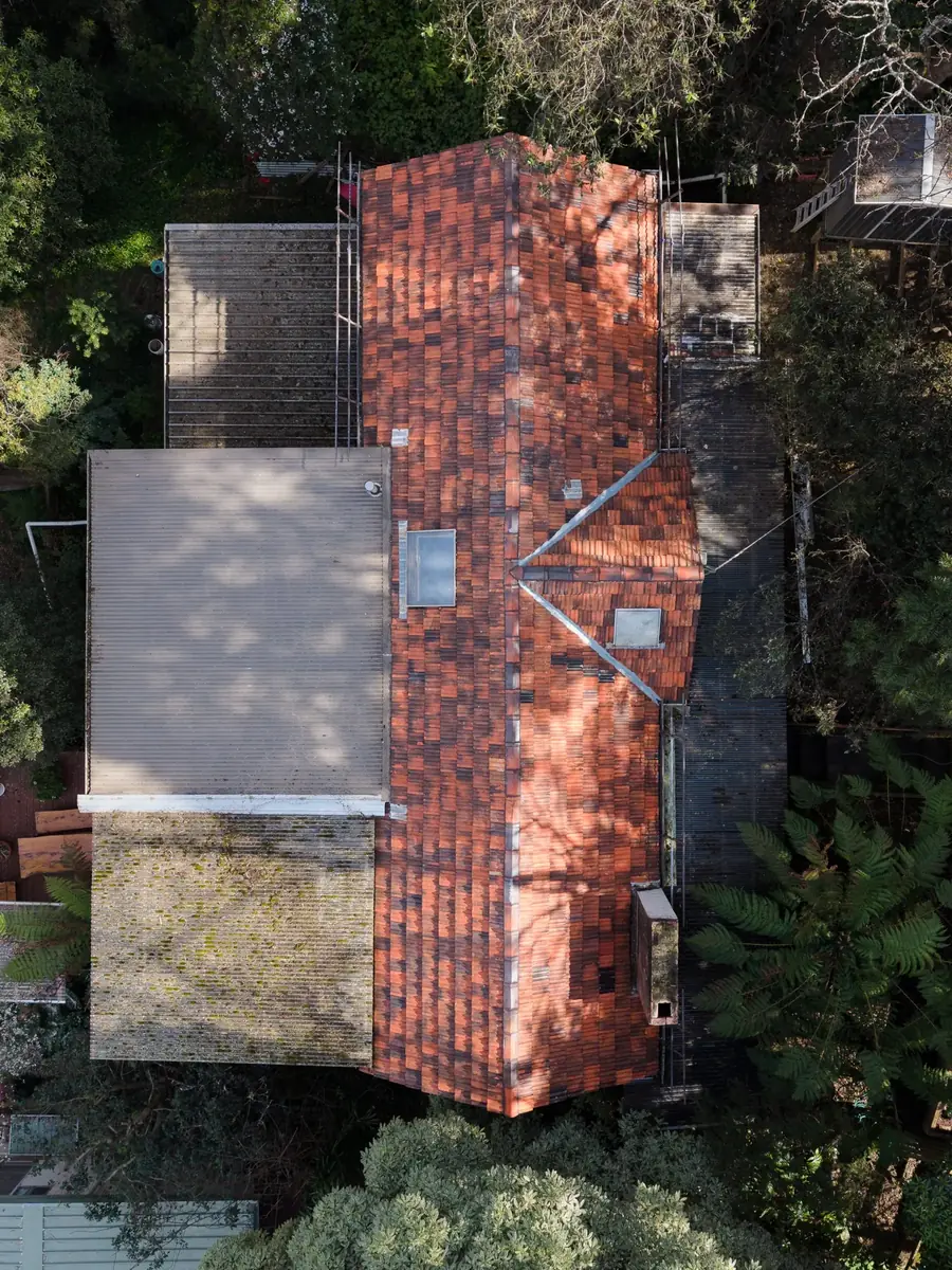 Terracotta tile roof and chimney from above